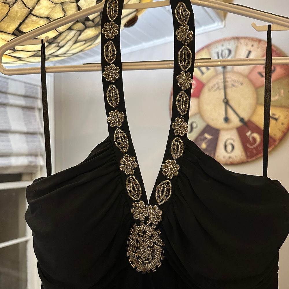 Very pretty women’s black dress with bead work.